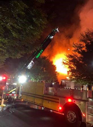 Firefighters from around the area battled flames from a fire in Ashburn Wednesday night that destroyed three houses.