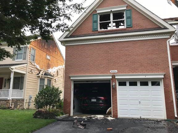 No one was home when a fire destroyed three houses and damaged one other in Ashburn Wednesday morning.