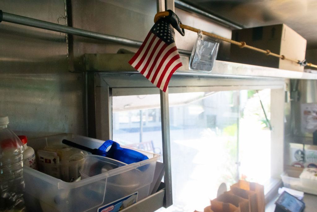 An American flag hangs inside <span style="font-weight: 400;">Rosen Ivanov's food truck. </span>