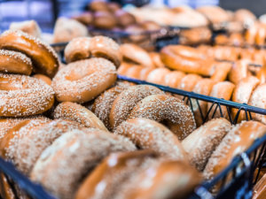 Closeup of many bagels in bakery