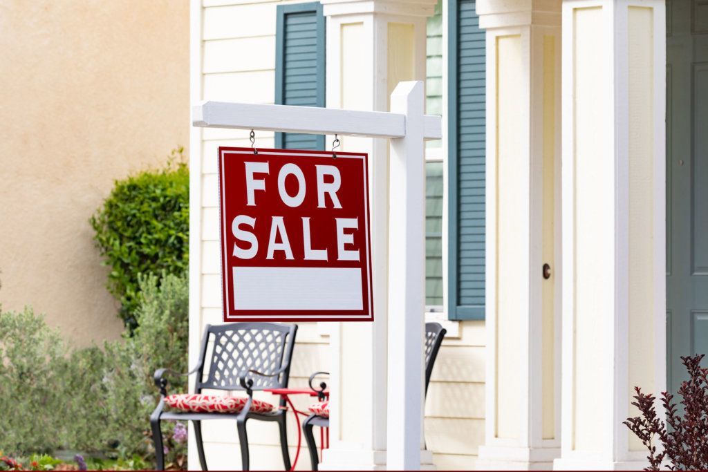 Home For Sale Real Estate Sign in Front of New House