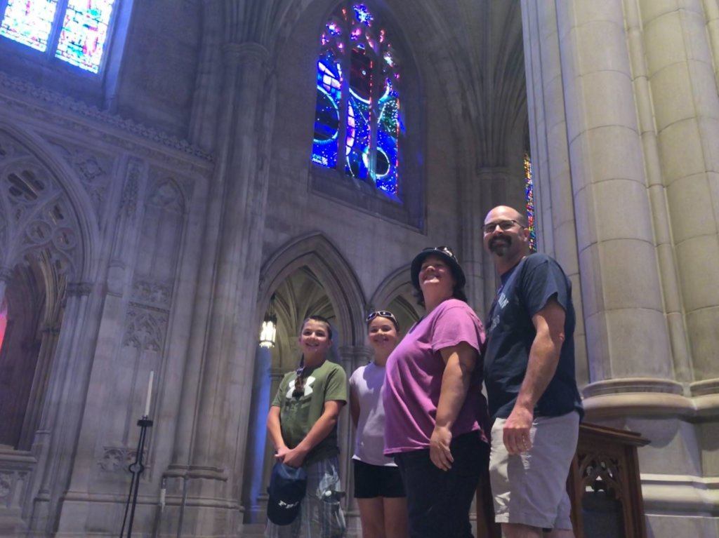 Jack Davis (left), 13, of Michigan, and sister Allie, 11, and parents Karen and Rick Davis all took in the Space Window at the National Cathedral.