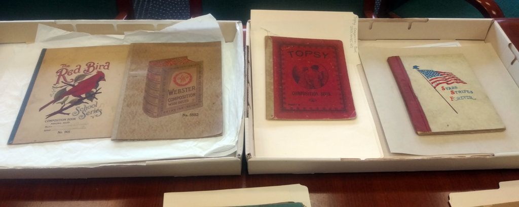 Composition books from the Division of Cultural and Community Life at the Smithsonian’s National Museum of American History. Second from right is a composition book that features Topsy from Harriet Beecher Stowe’s "Uncle Tom’s Cabin." The composition book on the right is from the 1920s, which represents the Americanization period from the 1880s through the 1920s.