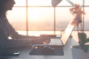 Working at home using computer, studying business ideas