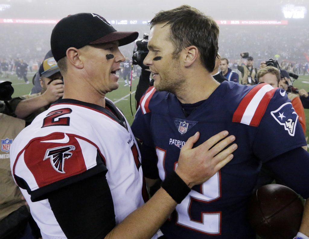 Atlanta Falcons quarterback Matt Ryan, left, and New England Patriots quarterback Tom Brady, right, speak at midfield after an NFL football game, Sunday, Oct. 22, 2017, in Foxborough, Mass.