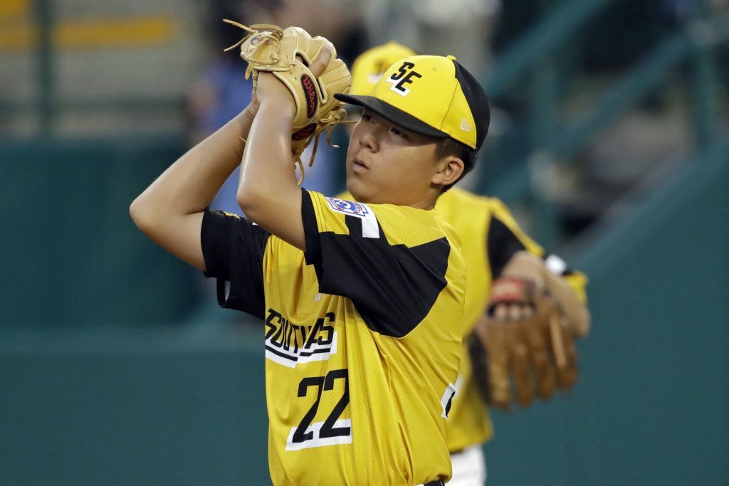 South Riding, Virginia's starting pitcher Justin Lee (22) reacts after Wailuku, Hawaii scores three runs during the first inning of a baseball game at the Little League World Series tournament in South Williamsport, Pa., Wednesday, Aug. 21, 2019.