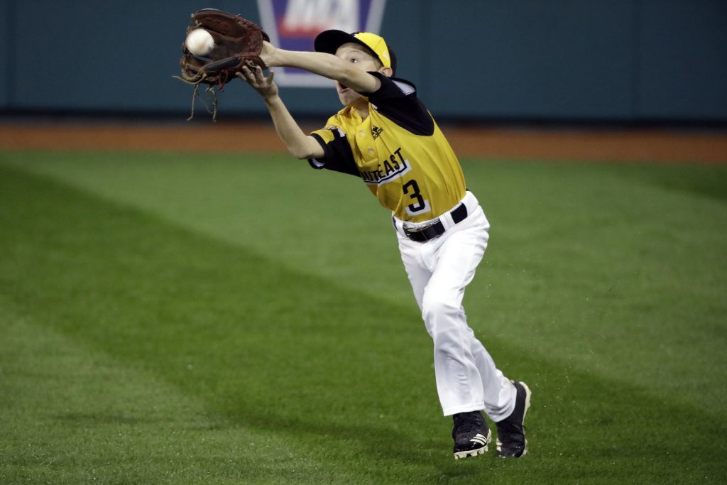 South Riding, Virginia's right fielder Michael Bowden (3) catches a ball hit by River Ridge, Louisiana's Conner Perrot during the first inning of a baseball game at the Little League World Series tournament in South Williamsport, Pa., Thursday, Aug. 22, 2019.