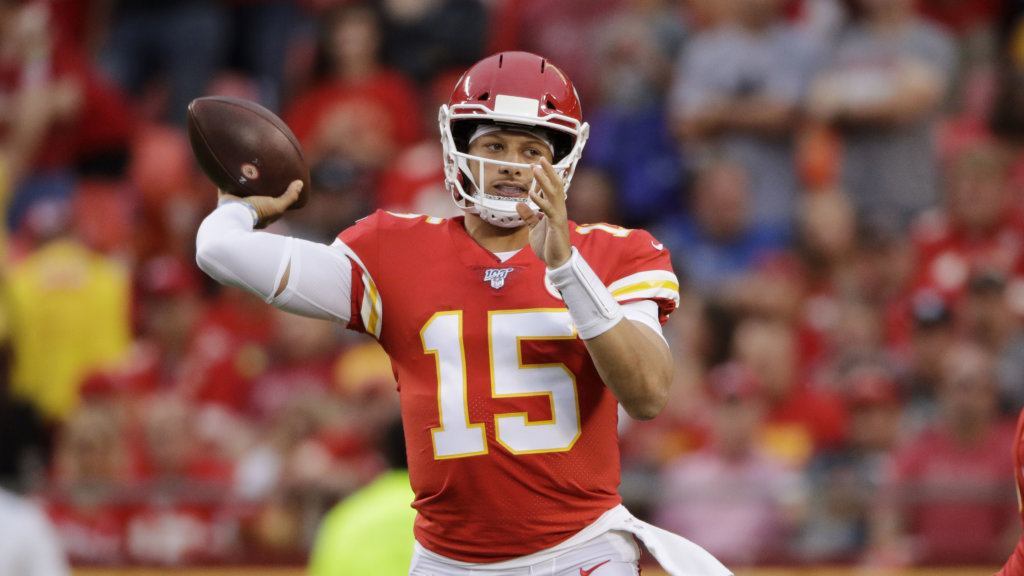 Kansas City Chiefs quarterback Patrick Mahomes (15) throws a touchdown pass to running back Damien Williams during the first half of an NFL preseason football game against the San Francisco 49ers in Kansas City, Mo., Saturday, Aug. 24, 2019.