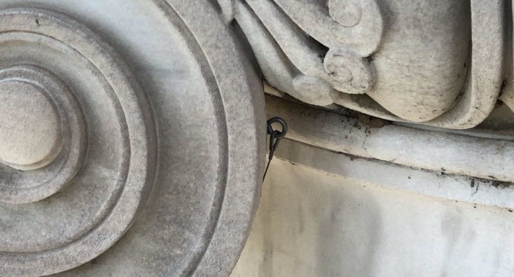 <p style="text-align: left;">Some of the column capitals are held up by wire, and it needs to be tightened.</p>