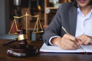 Judge gavel with Justice lawyers, Business woman in suit or lawyer working on a documents. Legal law, advice and justice concept.