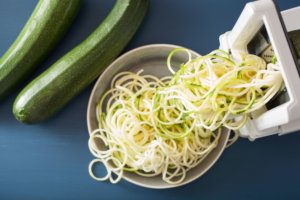 Spiralizing courgette raw vegetable with spiralizer