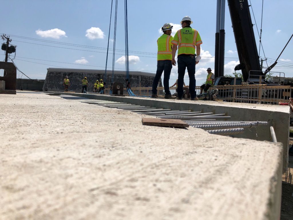 Three large sections of the new Wilson Boulevard bridge were staged in an empty lot on the north side of the junction.