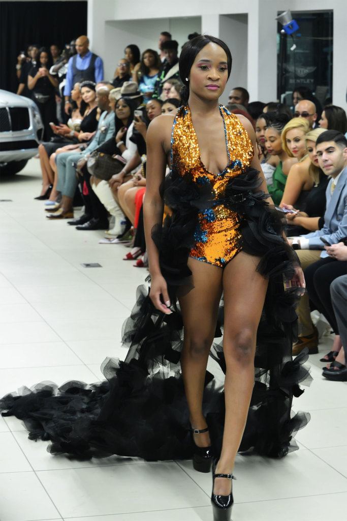 A model walks the runway at D.C. Fashion Week's opening night show on Friday, Sept. 27, 2019.