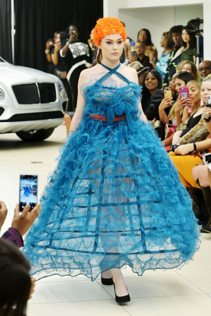 A model walks the runway at D.C. Fashion Week's opening night show on Friday, Sept. 27, 2019.