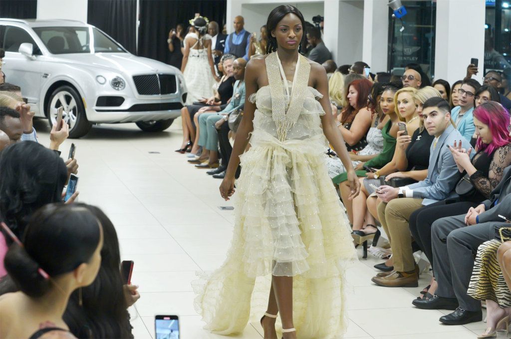 A model walks the runway at D.C. Fashion Week's opening night show.