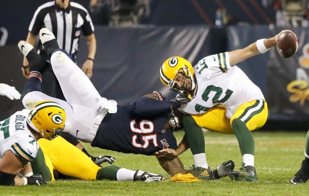 Chicago Bears' Roy Robertson-Harris sacks Green Bay Packers' Aaron Rodgers during the first half of an NFL football game Thursday, Sept. 5, 2019, in Chicago.