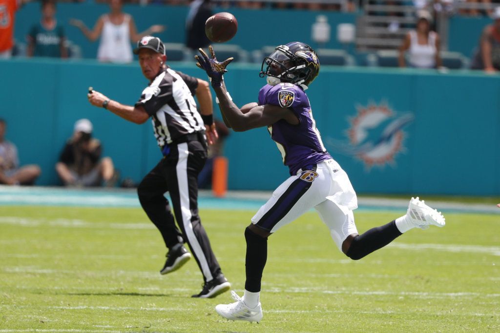Baltimore Ravens wide receiver Marquise Brown (15) grabs a pass for a touchdown, during the first half at an NFL football game against the Miami Dolphins, Sunday, Sept. 8, 2019, in Miami Gardens, Fla.