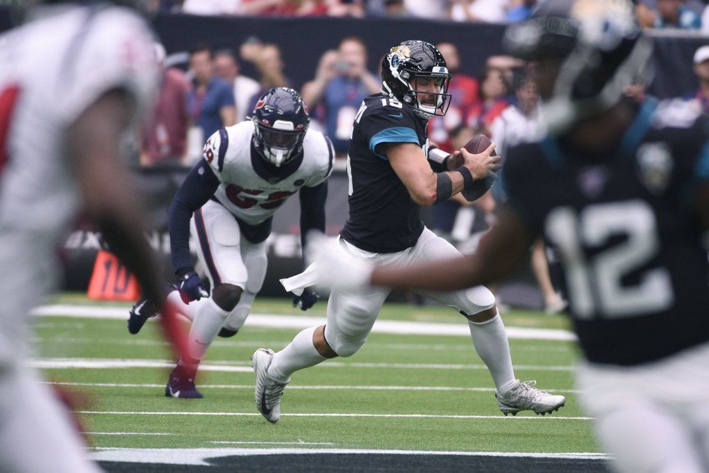 Jacksonville Jaguars quarterback Gardner Minshew (15) scramble for yards against the Houston Texans during the second half of an NFL football game Sunday, Sept. 15, 2019, in Houston.