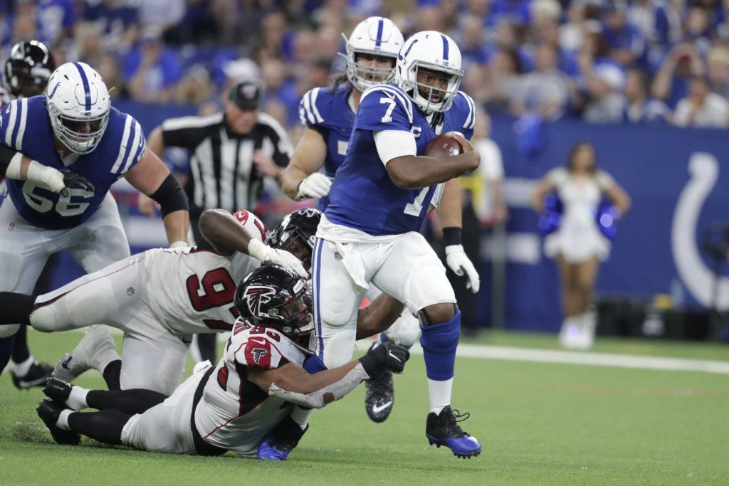 Indianapolis Colts quarterback Jacoby Brissett (7) runs out of the tackle of Atlanta Falcons defensive tackle Jack Crawford (95) during the second half of an NFL football game against the Atlanta Falcons, Sunday, Sept. 22, 2019, in Indianapolis.