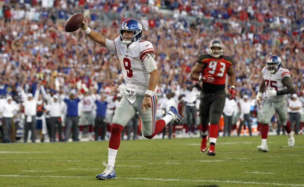 New York Giants quarterback Daniel Jones (8) scores on a 7-yard touchdown run against the Tampa Bay Buccaneers during the second half of an NFL football game Sunday, Sept. 22, 2019, in Tampa, Fla.