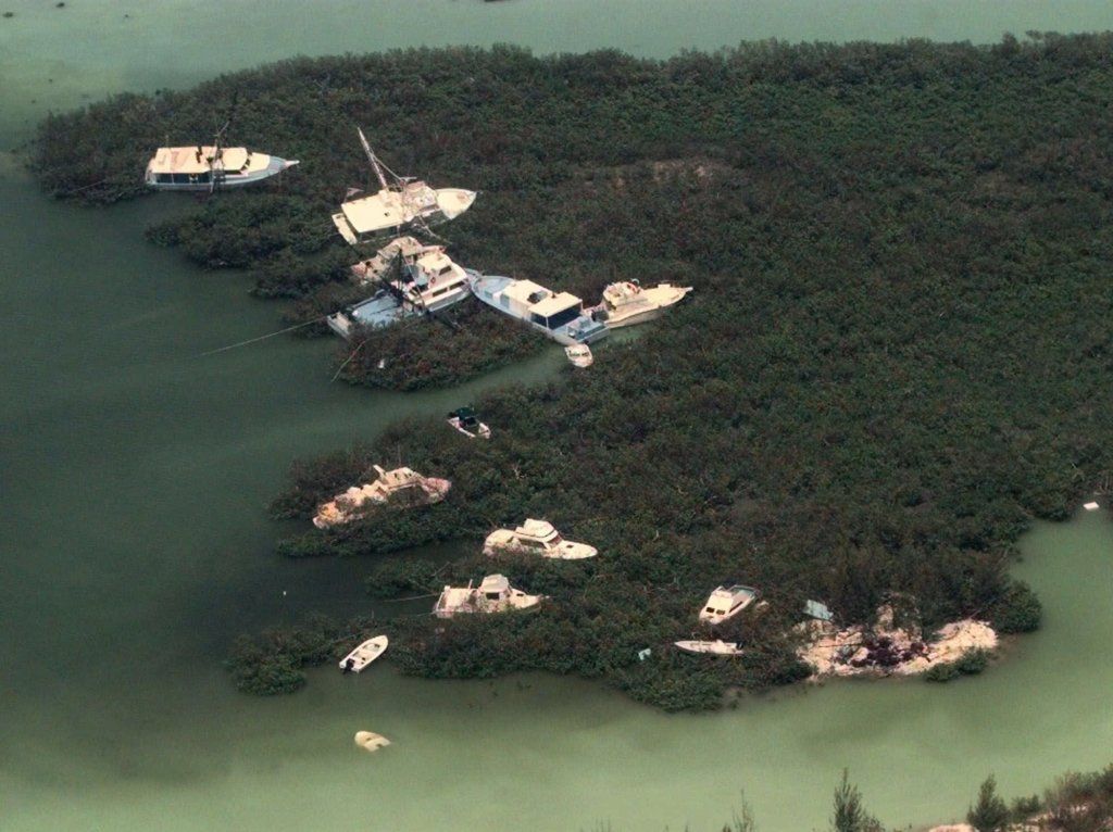 These boats are pushed into the brush Wednesday, Sept. 15, 1999 on the island of Eleuthera after Hurricane Floyd passed over the Bahamas on Tuesday with 110mph winds.