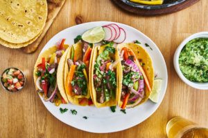 Tasty mexican tacos with beef fajita filling served with salsa