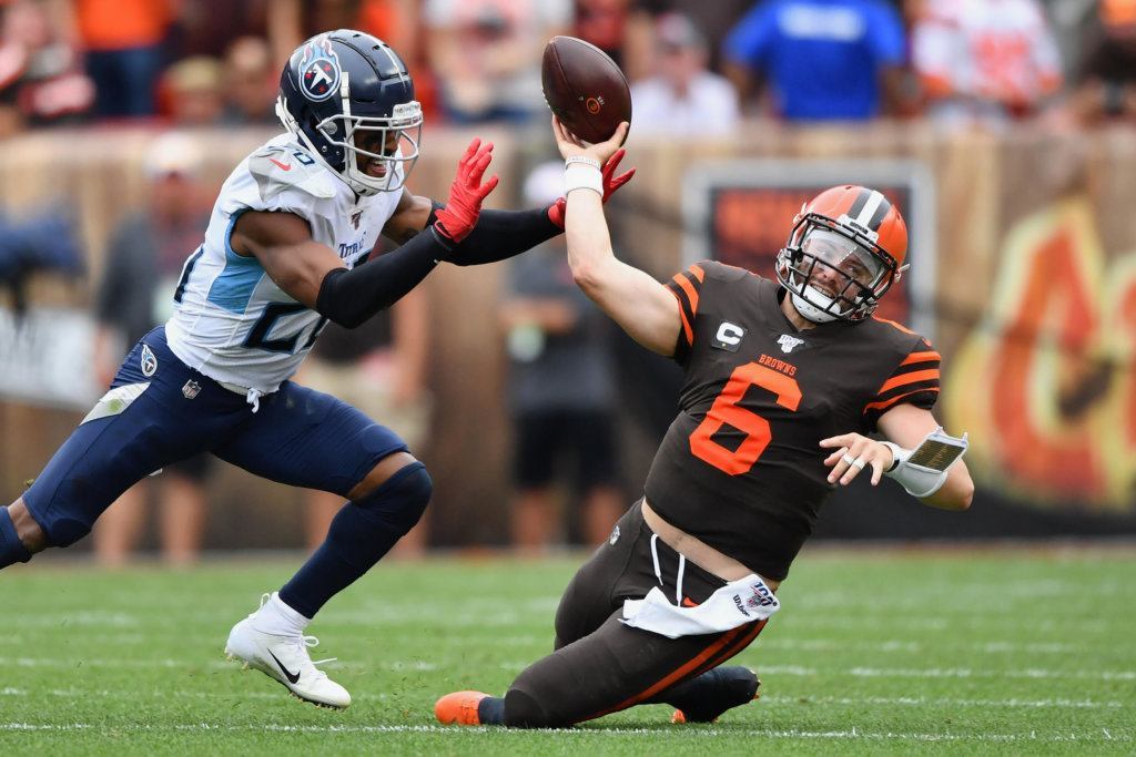 Quarterback Baker Mayfield #6 of the Cleveland Browns is sacked by Logan Ryan #26 of the Tennessee Titans in the second quarter at FirstEnergy Stadium on Sept. 8, 2019 in Cleveland, Ohio.