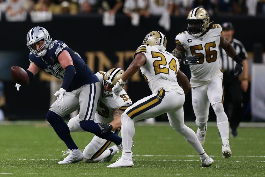 NEW ORLEANS, LOUISIANA — SEPTEMBER 29: Jason Witten #82 of the Dallas Cowboys stripped of the ball by A.J. Klein #53 of the New Orleans Saints during the first half of an NFL game at the Mercedes-Benz Superdome on September 29, 2019 in New Orleans, Louisiana.