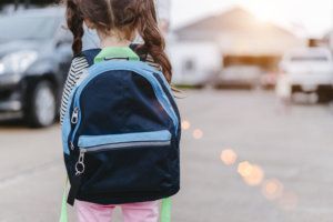 Children girl waiting mother get your back to home after study from school.
