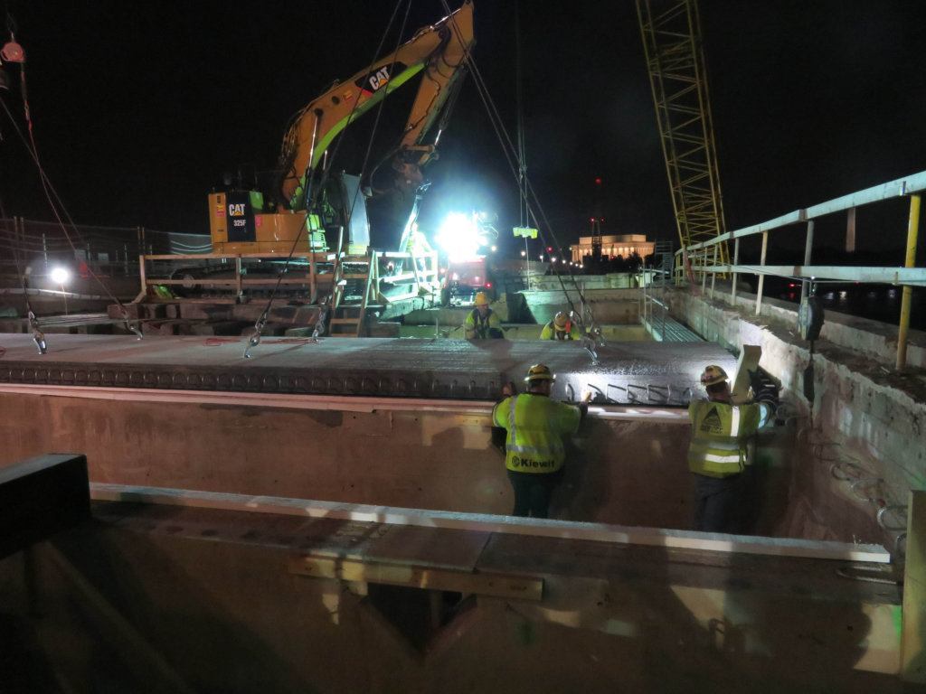 Crews install new deck panels on the Arlington Memorial Bridge.