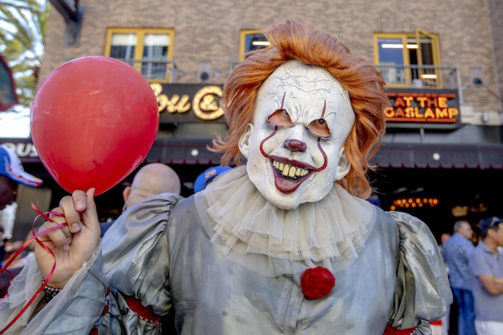 Fernando Calleros, from San Diego, Calif., dressed as "Pennywise" poses on Day Two at Comic-Con International on Friday, July 19, 2019, in San Diego, Calif.