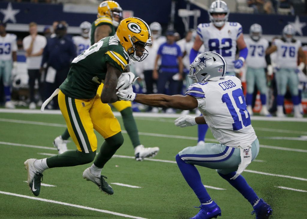 Green Bay Packers defensive back Chandon Sullivan (39) intercepts a Dallas Cowboys' Dak Prescott pass in front of wide receiver Randall Cobb (18) in the first half of an NFL football game in Arlington, Texas, Sunday, Oct. 6, 2019.