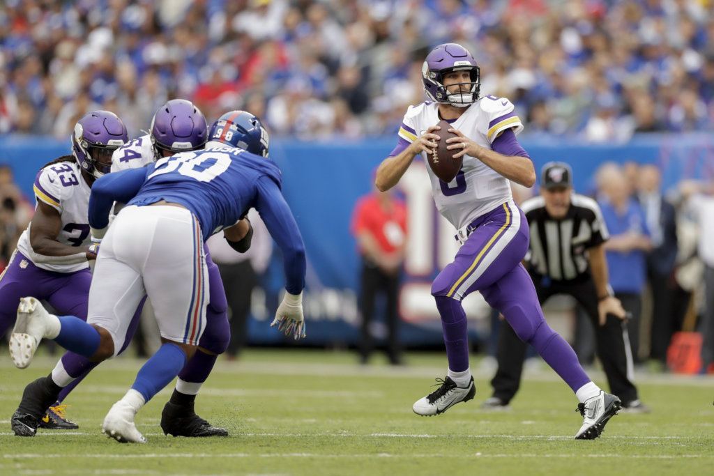 Minnesota Vikings quarterback Kirk Cousins (8) looks to pass against the New York Giants during the second quarter of an NFL football game, Sunday, Oct. 6, 2019, in East Rutherford, N.J.