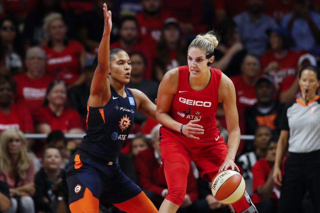 Washington Mystics forward Elena Delle Donne, right, drives against Connecticut Sun forward Alyssa Thomas during the first half of Game 5 of basketball's WNBA Finals, Thursday, Oct. 10, 2019, in Washington.