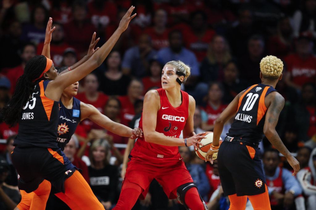 Connecticut Sun forward Jonquel Jones, left, and Connecticut Sun guard Courtney Williams, right, combine to guard Washington Mystics forward Elena Delle Donne, center, during the first half of Game 5 of basketball's WNBA Finals, Thursday, Oct. 10, 2019, in Washington.
