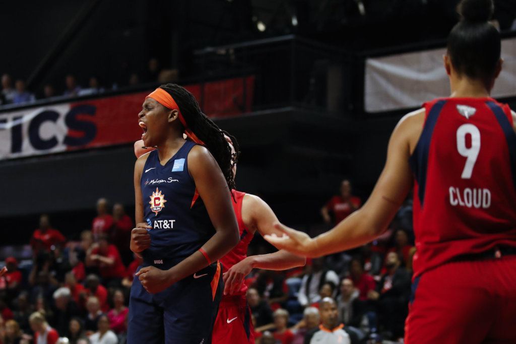 Connecticut Sun forward Jonquel Jones, left, celebrates after her basket during the first half of Game 5 of basketball's WNBA Finals against the Washington Mystics, Thursday, Oct. 10, 2019, in Washington.