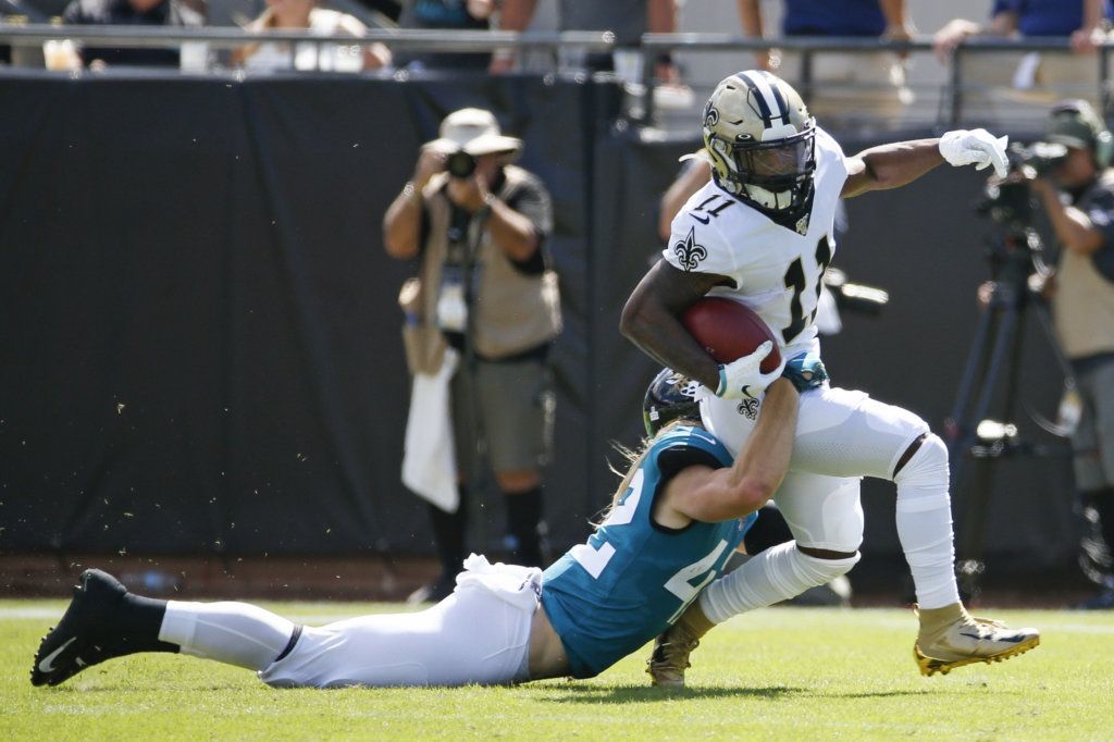 New Orleans Saints wide receiver Deonte Harris (11) is brought down by Jacksonville Jaguars defensive back Andrew Wingard, left, during the first half of an NFL football game, Sunday, Oct. 13, 2019, in Jacksonville, Fla.