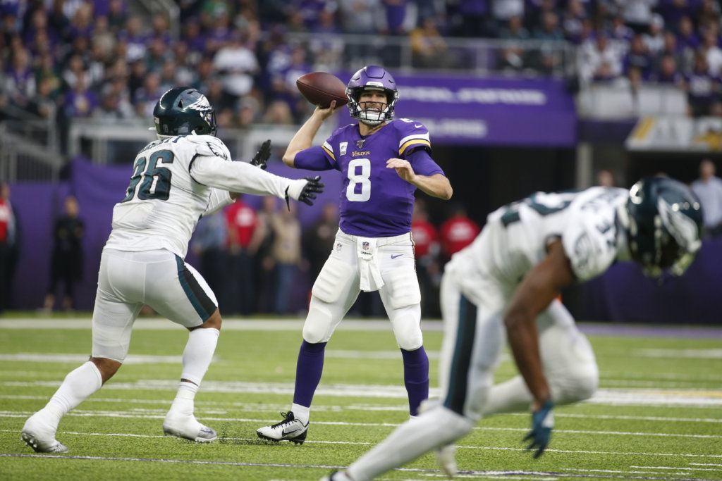 Minnesota Vikings quarterback Kirk Cousins (8) throws a pass during the second half of an NFL football game against the Philadelphia Eagles, Sunday, Oct. 13, 2019, in Minneapolis.