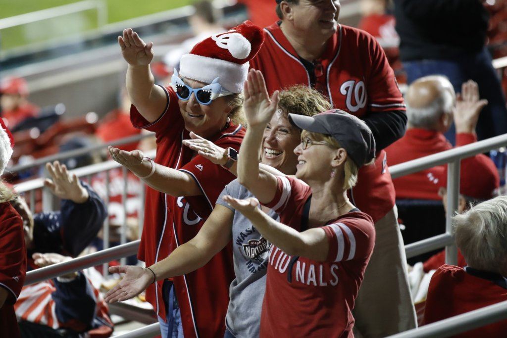 Baby shark!! Fans cheer before Game 3 of the baseball National League Championship Series between the St. Louis Cardinals and the Washington Nationals Monday, Oct. 14, 2019, in Washington.