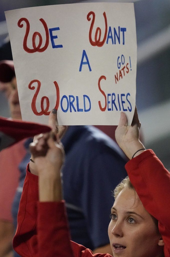 A Washington Nationals fan cheers during the fifth inning of Game 3 of the baseball National League Championship Series against the St. Louis Cardinals Monday, Oct. 14, 2019, in Washington.