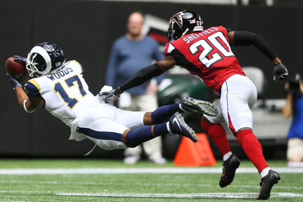 Los Angeles Rams wide receiver Robert Woods (17) makes the catch against Atlanta Falcons defensive back Kendall Sheffield (20) during the first half of an NFL football game, Sunday, Oct. 20, 2019, in Atlanta.