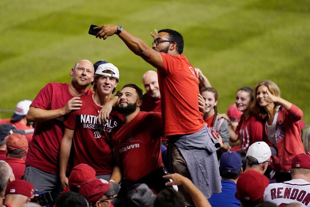 Fans take a photo in the outfield stands at Nationals Park on Oct. 7, 2019 in Washington, D.C.