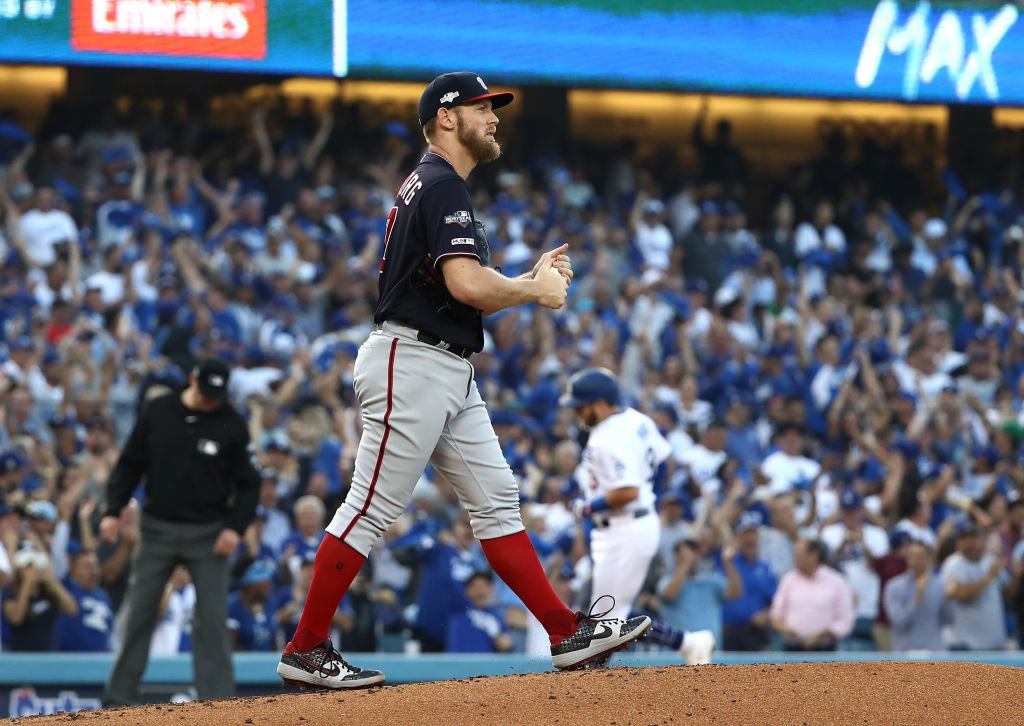 LOS ANGELES, CALIFORNIA - OCTOBER 09: Stephen Strasburg #37 of the Washington Nationals reacts after giving up a two run home run to Max Muncy #13 of the Los Angeles Dodgers of game five of the National League Division Series at Dodger Stadium on October 09, 2019 in Los Angeles, California.