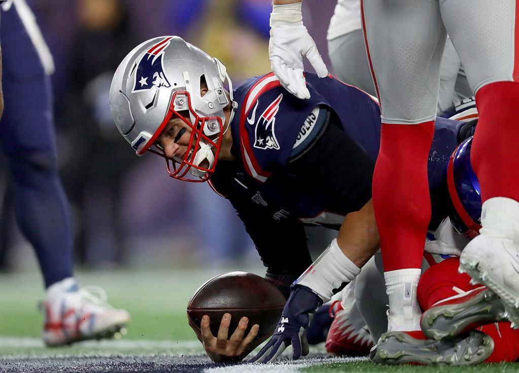 FOXBOROUGH, MASSACHUSETTS - OCTOBER 10: Tom Brady #12 of the New England Patriots celebrates after scoring a one-yard touchdown against the New York Giants during the fourth quarter in the game at Gillette Stadium on October 10, 2019 in Foxborough, Massachusetts.