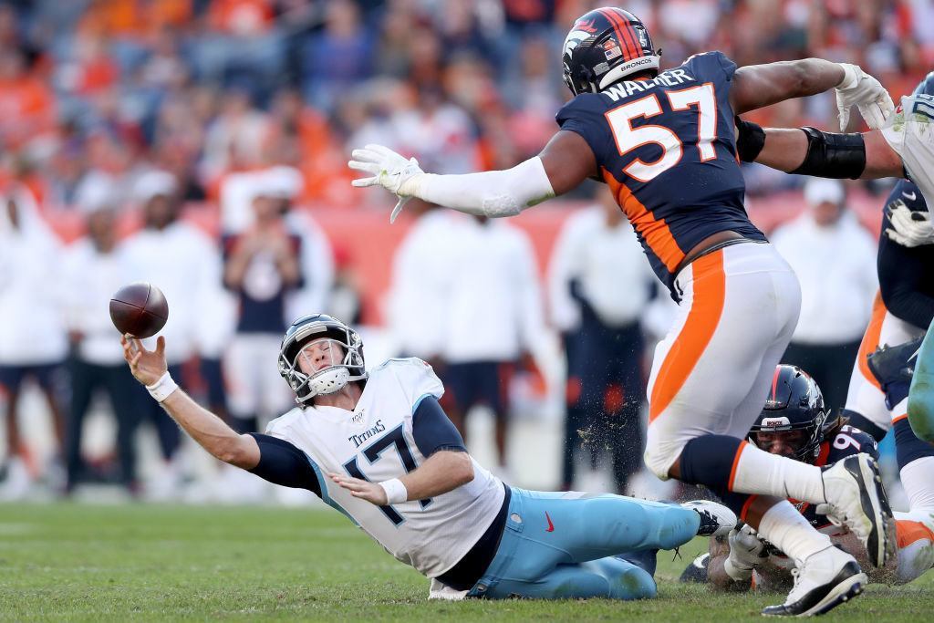DENVER, COLORADO - OCTOBER 13: Quarterback Ryan Tannehill #17 of the Tennessee Titans is sacked against the Denver Broncos in the fourth quarter at Broncos Stadium at Mile High on October 13, 2019 in Denver, Colorado.