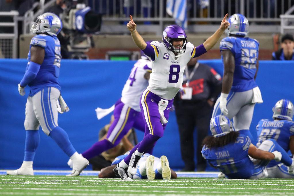 Kirk Cousins #8 of the Minnesota Vikings reacts to a late fourth quarter touchdown run by Dalvin Cook #33 to seal the game against the Detroit Lions at Ford Field on October 20, 2019 in Detroit, Michigan.