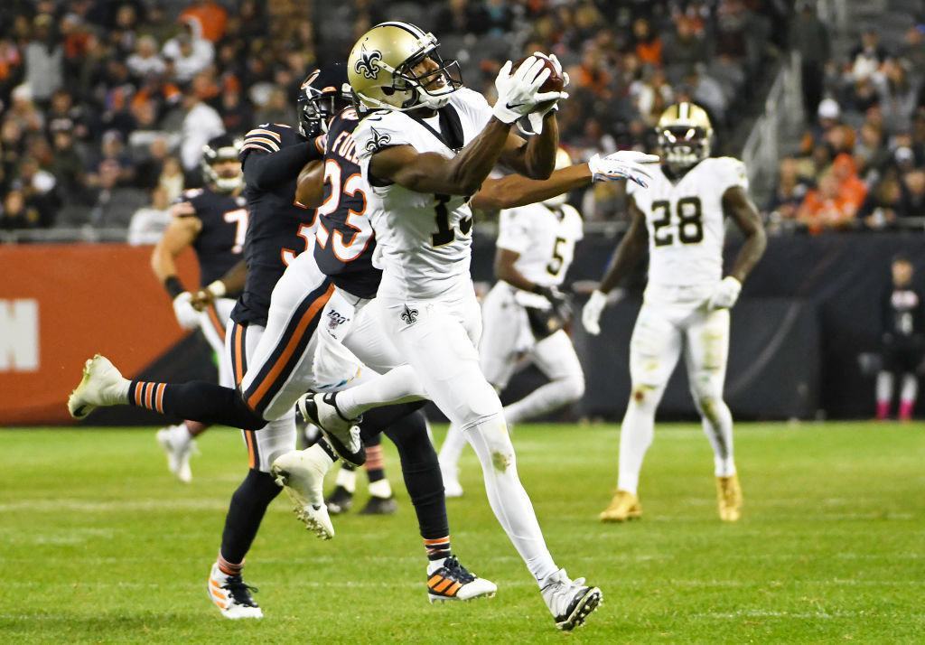 Michael Thomas #13 of the New Orleans Saints catches a pass as Kyle Fuller #23 of the Chicago Bears defends him during the second half at Soldier Field on October 20, 2019 in Chicago, Illinois. The New Orleans Saints defeated the Chicago Bears 36-25.