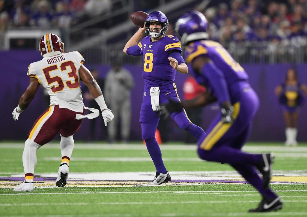 MINNEAPOLIS, MINNESOTA - OCTOBER 24: Quarterback Kirk Cousins #8 of the Minnesota Vikings looks to deliver a pass against the defense of Jon Bostic #53 of the Washington Redskins during the game at U.S. Bank Stadium on October 24, 2019 in Minneapolis, Minnesota.