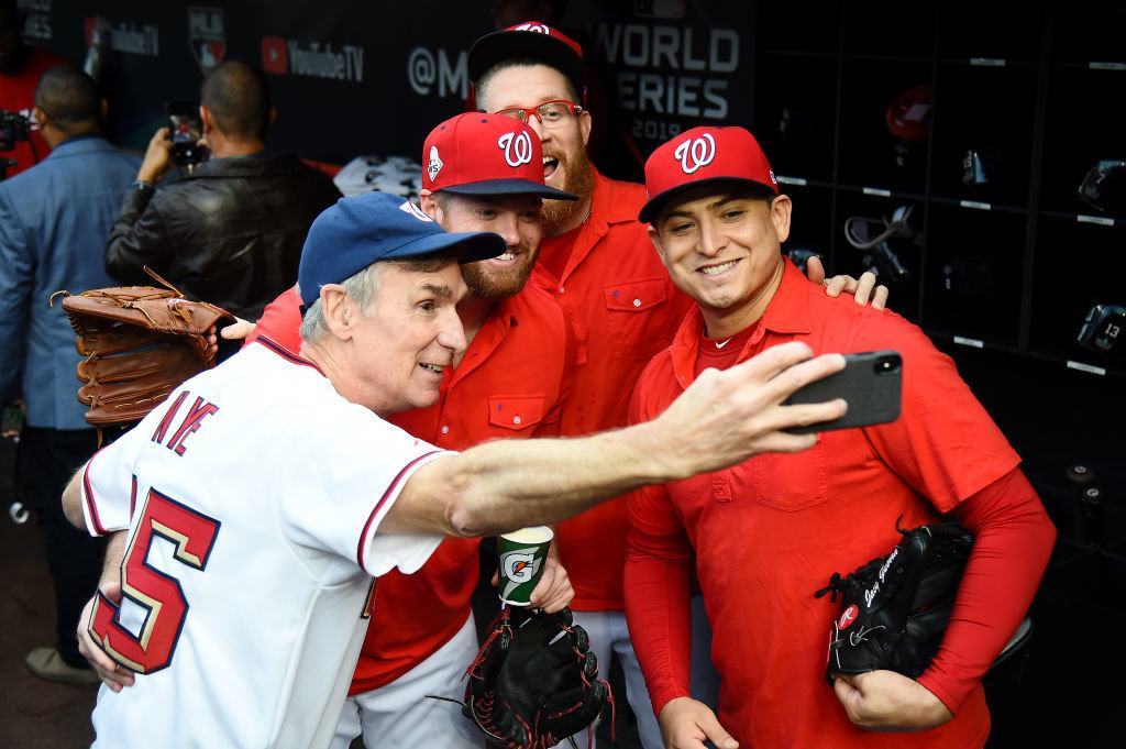 Bill Nye takes selfies in the dugout during batting practice prior to Game Three of the 2019 World Series against the Houston Astros at Nationals Park on October 25, 2019 in Washington, DC.