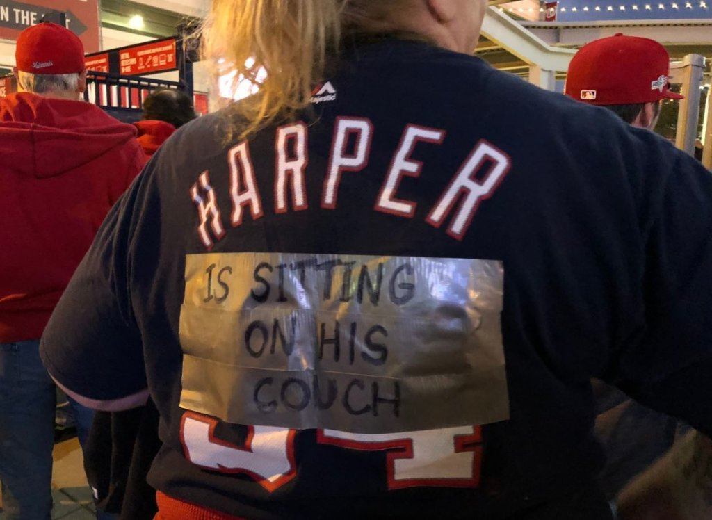 A Nats fan displays the jersey of former player Bryce Harper during an NLDS Game 5 watch party on Wednesday, Oct. 9, 2019.